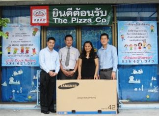 Tic (second right) receives the Little Duck Nursery’s new television.